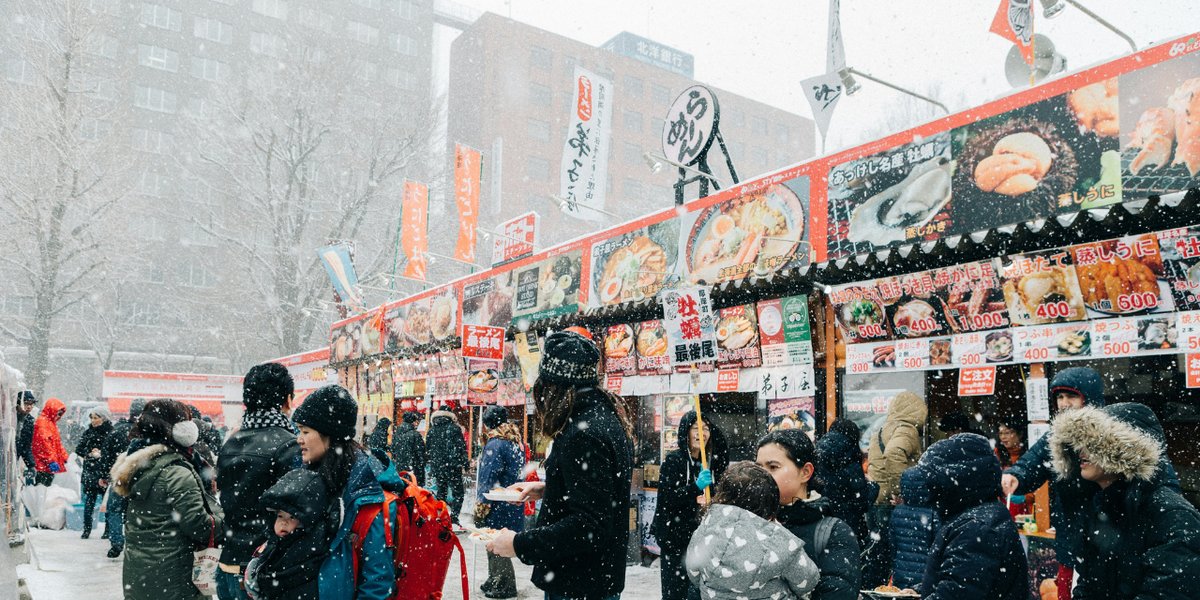 Snowy food stalls at the Sapporo Snow Festival
